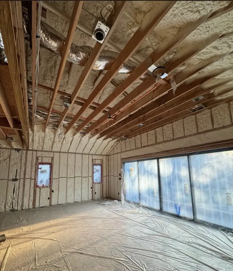 Interior walls and ceiling insulated with spray foam during new construction in Maine